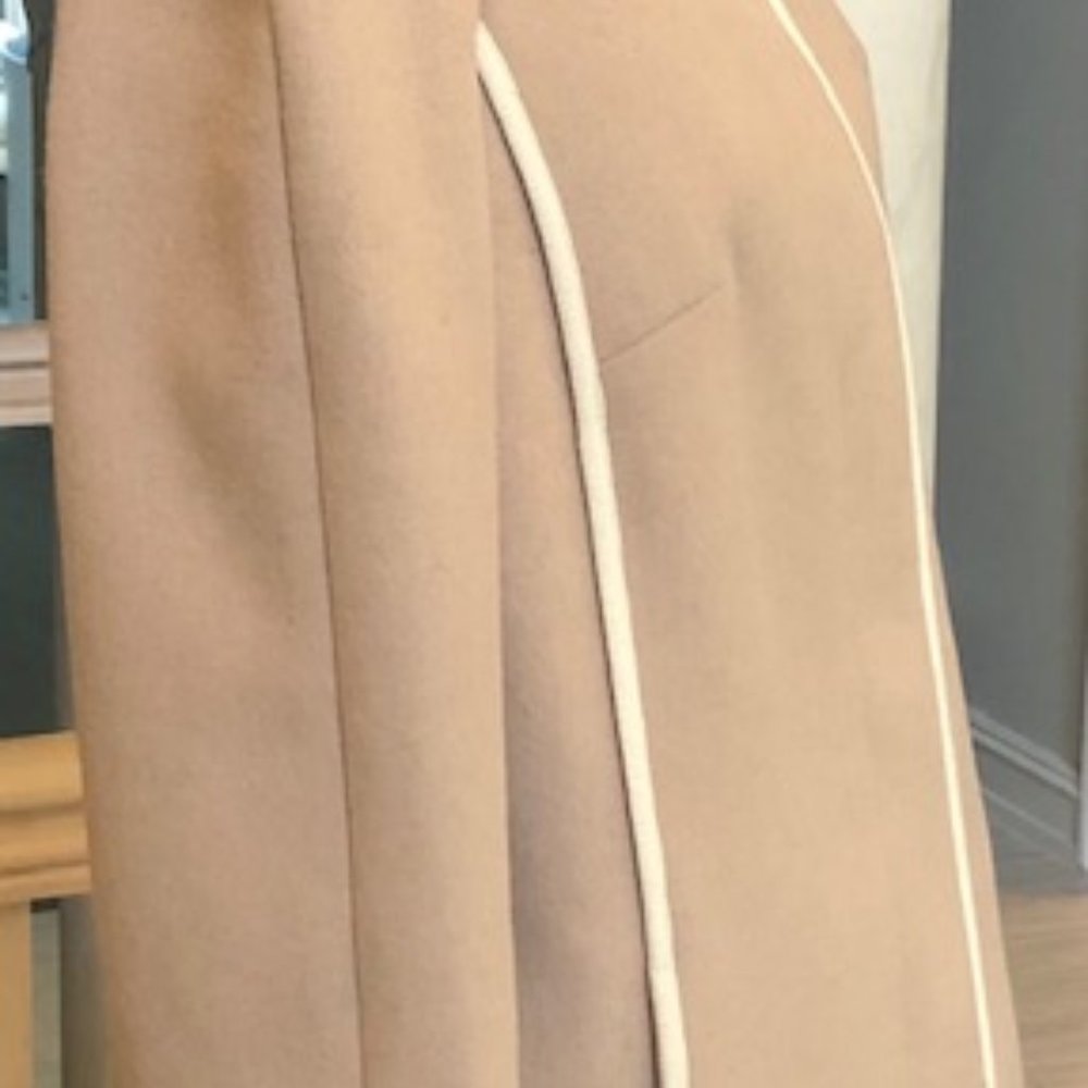 Tan Wool Stadium Jacket trimmed with white piping.